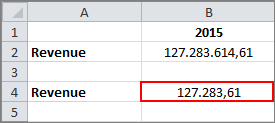 Shows an Excel section. The value entered for the second tilde formula in this example is marked in red; it is one thousandth of the original value.