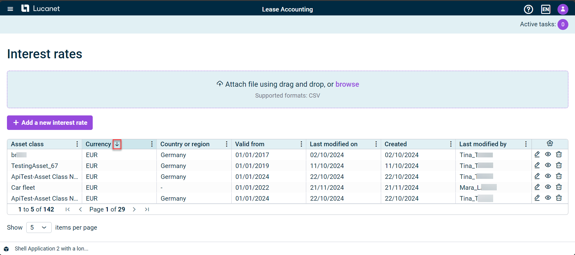 Shows the 'Interest rates' workspace in Lucanet Lease Accounting with a table with the columns 'Asset class', 'Currency', 'Country or region', 'Valid from', 'Last modified on', 'Created', and 'Last modified by'. Highlighted in red is the arrow icon next to the 'Currency' column name.
